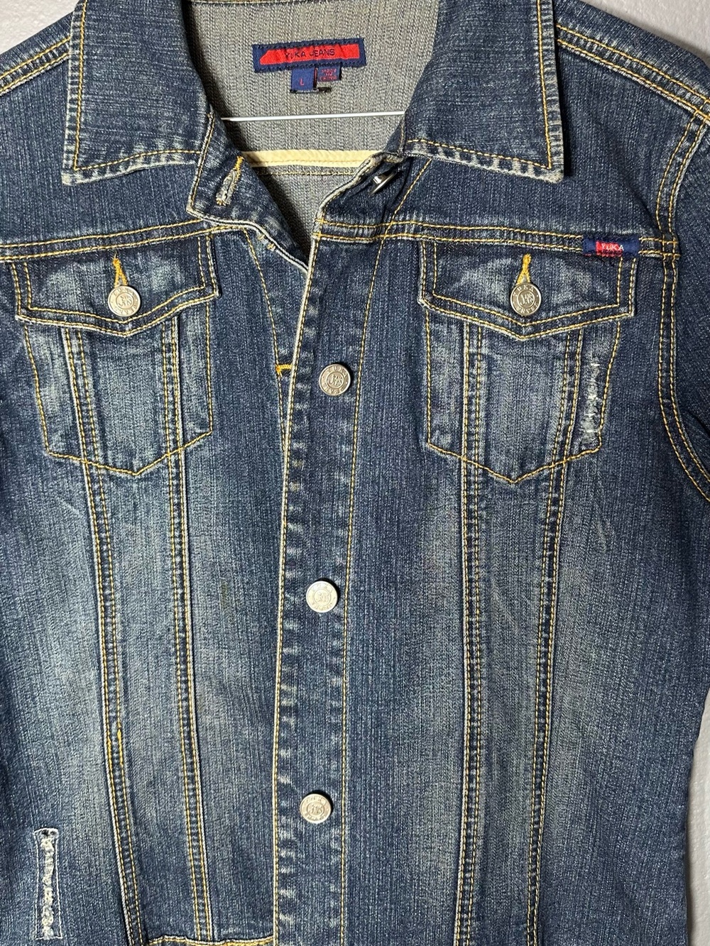 Vintage-Style Blue Denim Jean Jacket - Signature Red Tab Detail. Yuka jeans.